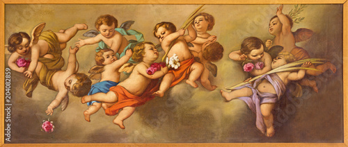 REGGIO EMILIA, ITALY - APRIL 12, 2018: The painting of angels in church Chiesa dei Cappuchini by Padre Angelico da Villarotta (1900 - 1987).