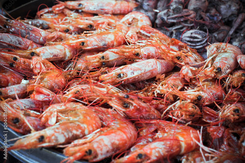 a lot of freshly prepared shrimps on a platter