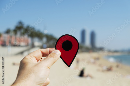 man with a red marker in La Barceloneta beach