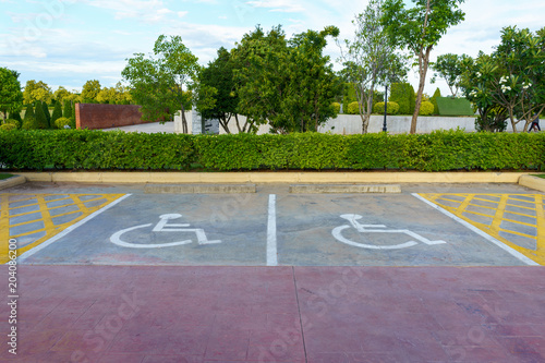 Photo Wheelchair sign at car park reserved for cripple person.