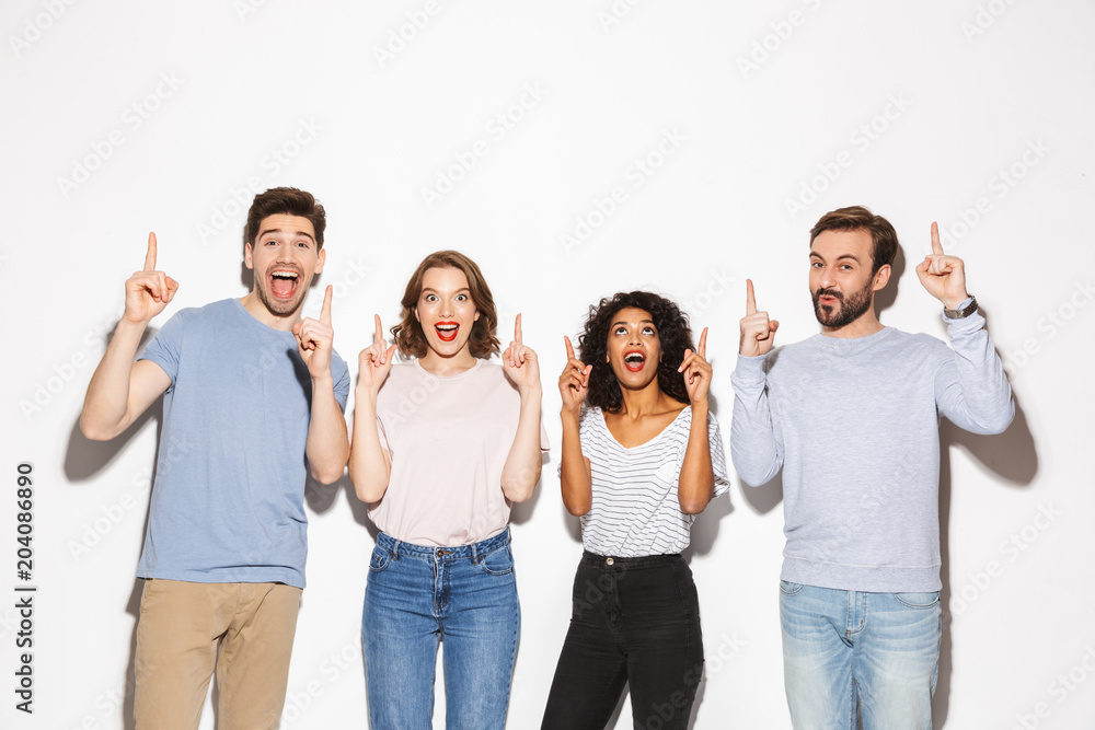 Group of happy multiracial people pointing fingers up Group of happy multiracial people pointing fingers up