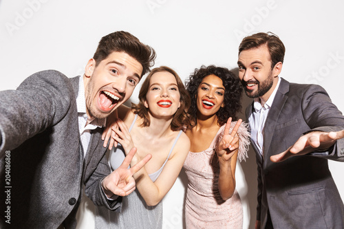 Group of joyful well dressed multiracial people