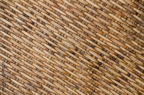 Background Old Thai handcraft of plaited bamboo strips weave pattern for texture.