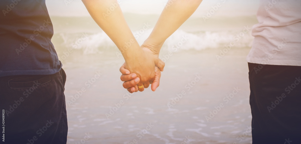 Hand lovers Symbol of love Honeymoon vacation in a tropical Eastern Sea of Thailand Hand lovers Symbol of love Honeymoon vacation in a tropical Eastern Sea of Thailand