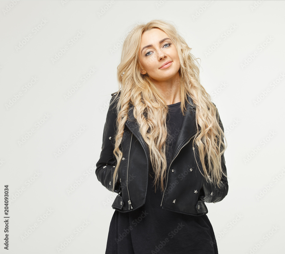 portrait of attractive beautiful young blond woman in black jacket on white background. portrait of attractive beautiful young blond woman in black jacket on white background.