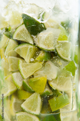 Close-up of lime with ice served in a glass