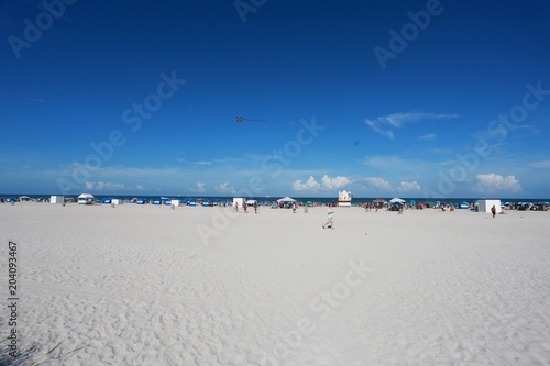 Miami Beach at 8th Street Calle Ocho in a Bright Sunny Afternoon in June with Blue Sky and Scattered Clouds Overhead photo