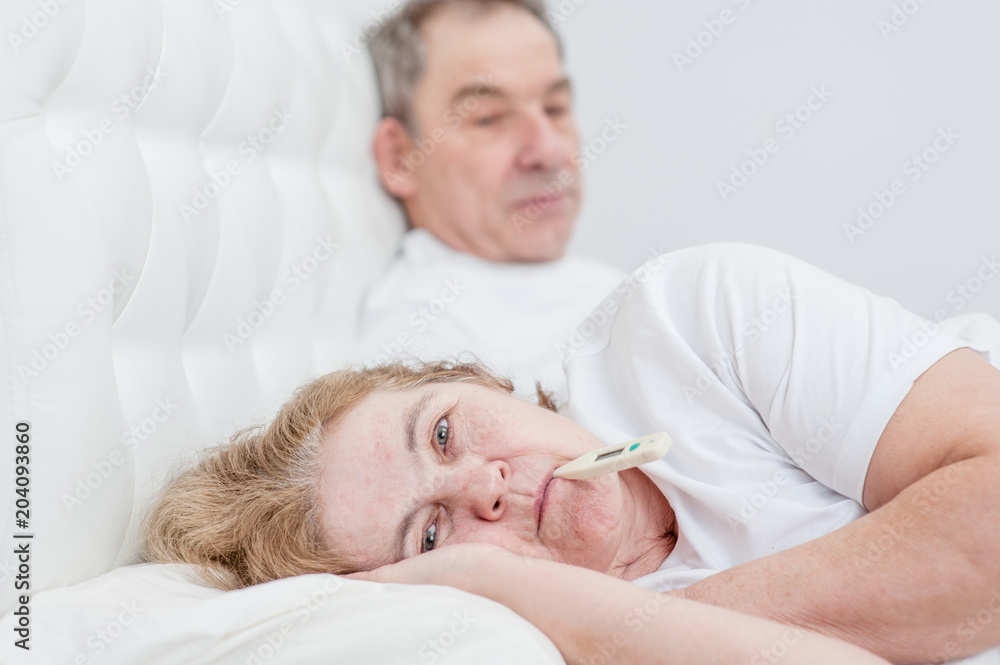 old man with sick wife on the bed old man with sick wife on the bed