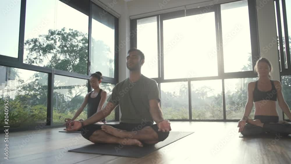 International group people meditate yoga class high key shot rapid slow motion International group people meditate yoga class high key shot rapid slow motion