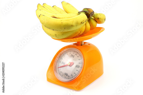 Banana and scale for waight measuring photo