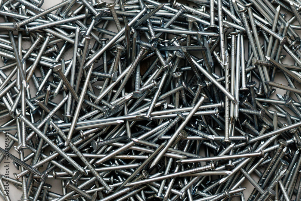 Background of silver steel long building nails Background of silver steel long building nails