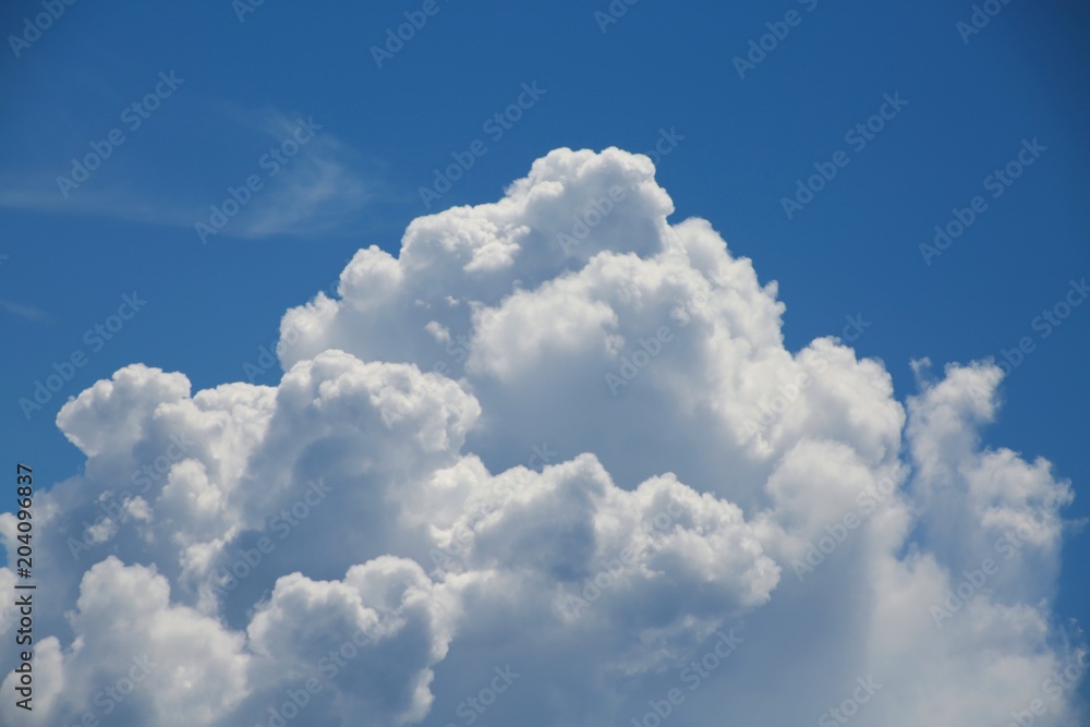 Fluffy Billowy Cumulus Clouds in the Blue Summer Sky in Florida