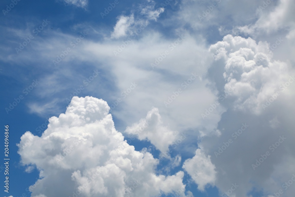 Fluffy Billowy and Wispy Cumulus Clouds in the Blue Summer Sky in Florida Fluffy Billowy and Wispy Cumulus Clouds in the Blue Summer Sky in Florida