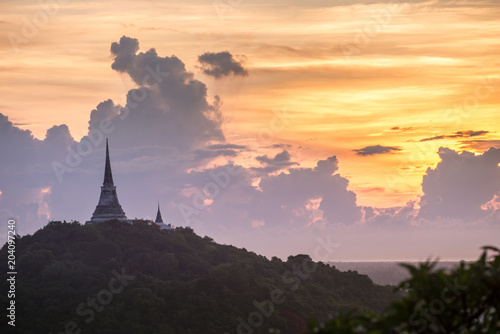 silhouette of Buddha pagoda with sunset sky