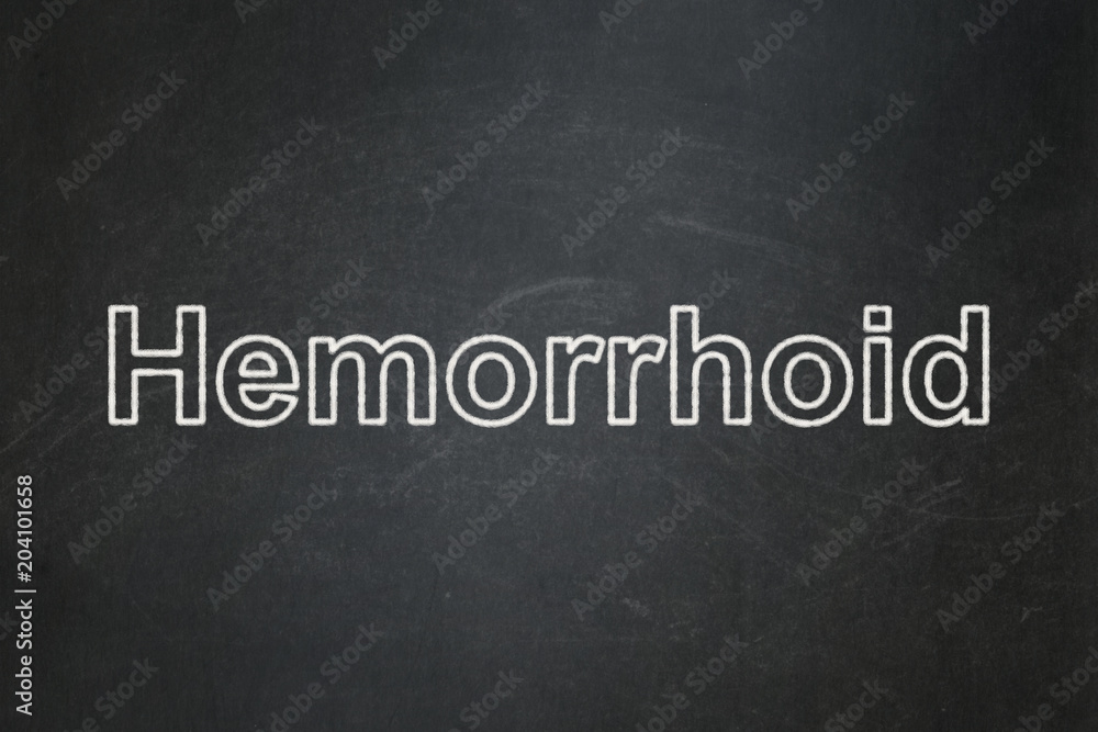 Healthcare concept: text Hemorrhoid on Black chalkboard background Healthcare concept: text Hemorrhoid on Black chalkboard background