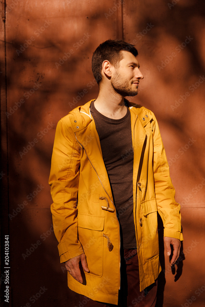A handsome and fashionable guy in stylish clothes on the street A handsome and fashionable guy in stylish clothes on the street