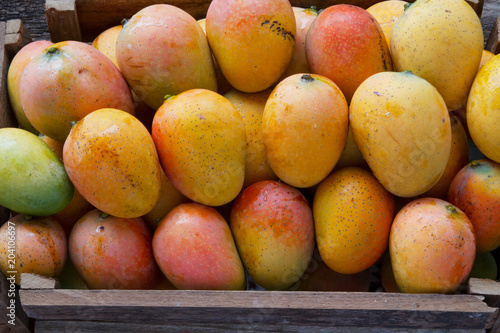 Mango fruits in basket at Indian fresh market close up