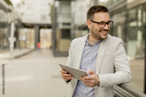 Young businessman with digi...