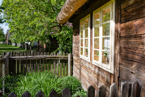 Traditional old polish countryside wooden thatched houses and farmyards. photo