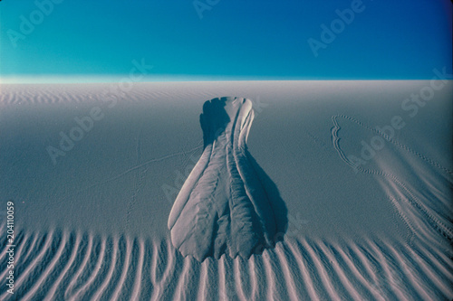 Sand Dune Landslide Abstract. A critter crossing the dune face destabilized a section and the small scale  landslide slid out, Kelso Dunes, Mojave National Preserve, Mojave Desert, California  photo