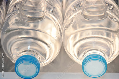 fresh water plastic bottle arranging in refrigerator