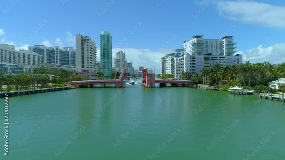 Aerial Miami yacht passing under open draw bridge Aerial Miami yacht passing under open draw bridge