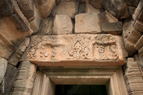 Carvings on the wall in the ancient Angkor Thom Baphuon Temple in the Angkor Area, near Siem Reap, Cambodia, Asia. Buddhist monastery from the 12th century. Asian architectural background.