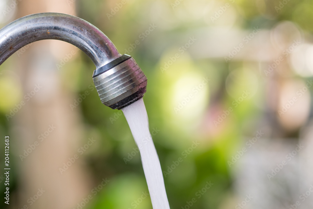 Water flowing from faucet. Water flowing from faucet.