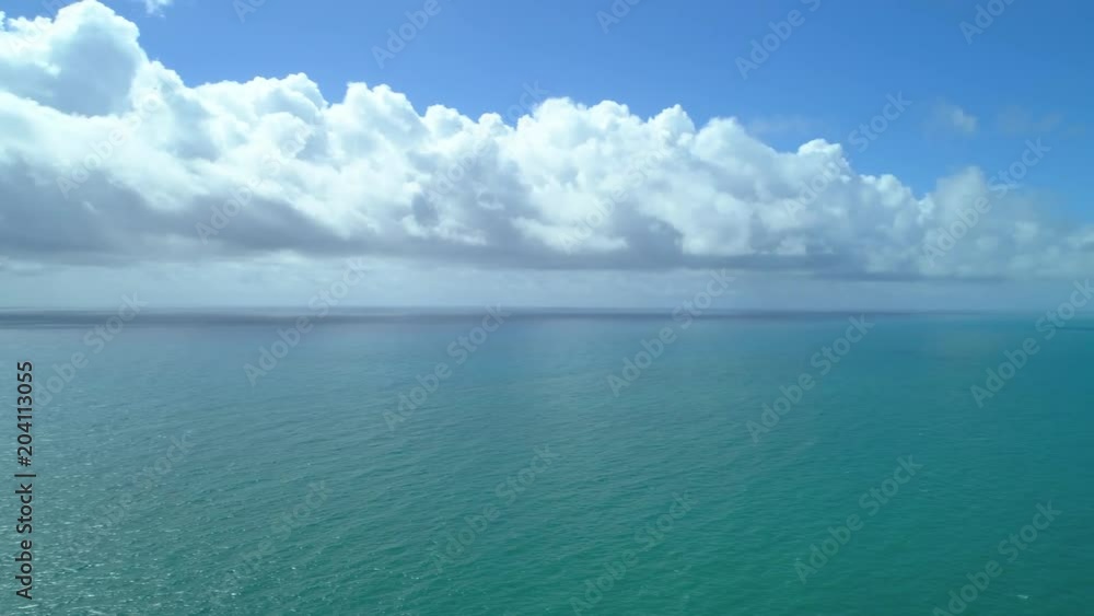 Aerial panning right shot atlantic ocean sea to Miami Beach Sunny Isles Florida