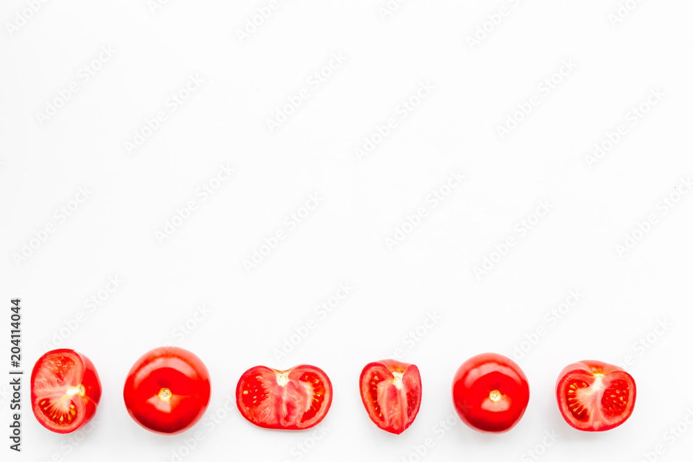 Layout of fresh red tomatoes on white background top view copy space Layout of fresh red tomatoes on white background top view copy space