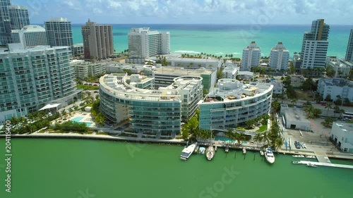 Aerial tilt down camera waterfront condominiums Miami Beach