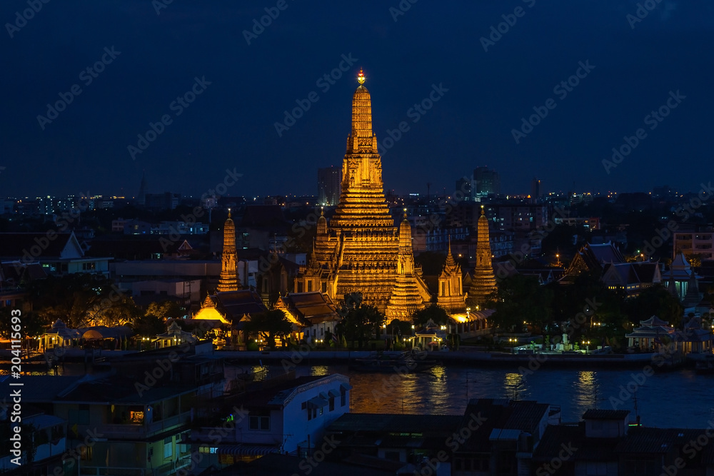 Wat Arun Temple at twilight in bangkok Thailand .