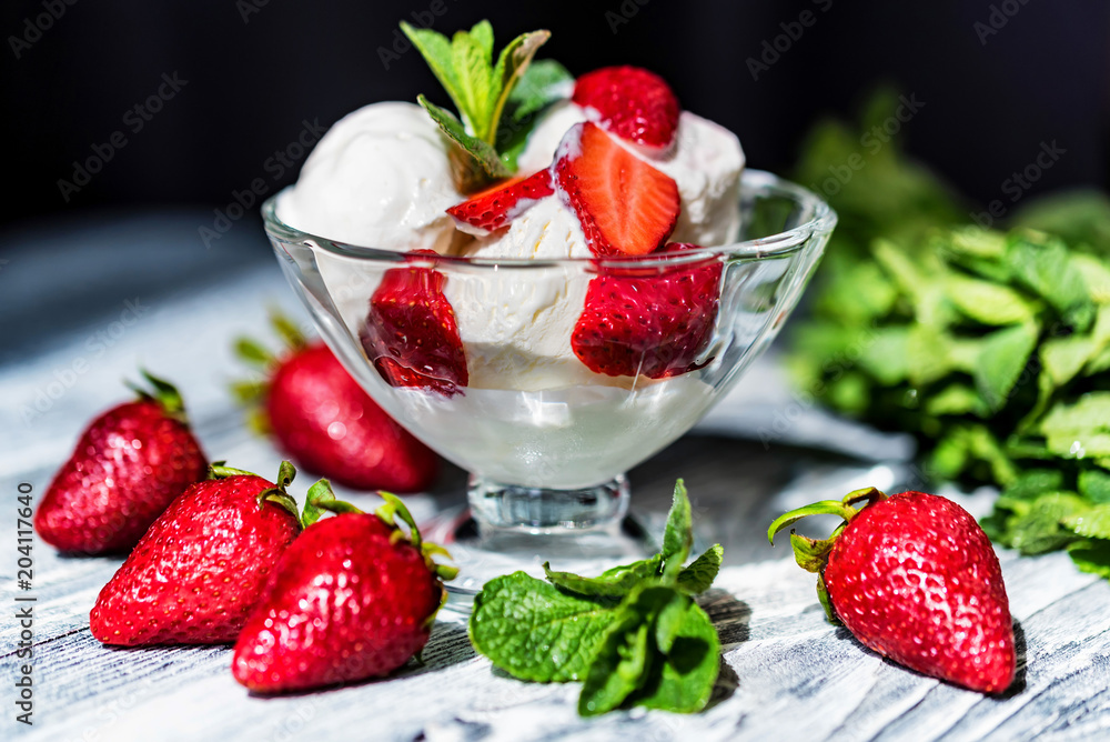 Strawberry ice cream in bowl and strawberries Strawberry ice cream in bowl and strawberries