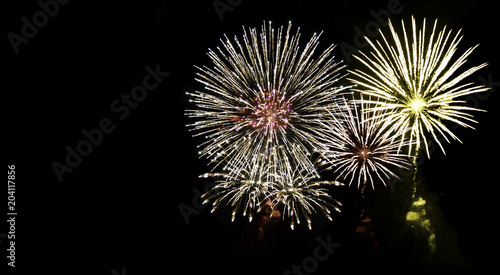 Brightly Colorful Fireworks isolated black background with clipping path. New Year celebration fireworks.