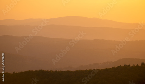 Hills during orange sundown. Natural composition