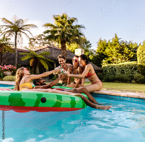 Photography Multi-ethnic friends enjoying at pool party