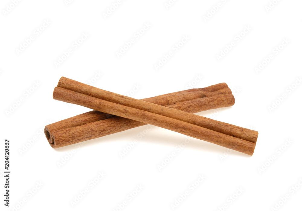 two cinnamon sticks on a white background