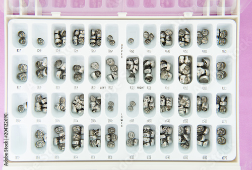 Close up metal teeth in box separated size prepare for use in dental clinic.