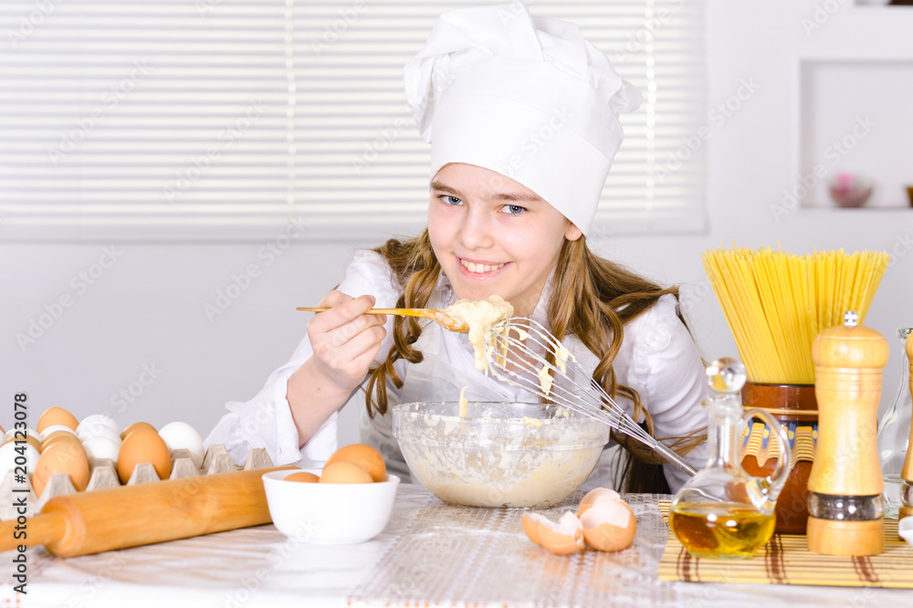 Cute girl cooking in the kitchen Cute girl cooking in the kitchen