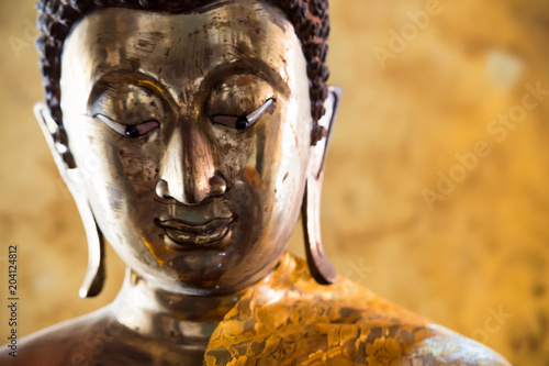 Close up face of Buddha statue used as amulets in Buddhism religion