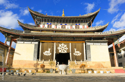 A Traditional Tibetan monastery building in the old town of Dukezong, now called Shangri-la in Yunnan Province, China photo