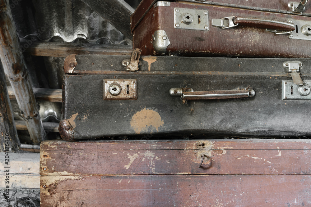 Two Old, Rusty, Dusty and Dirty Suitcases Lying on the Brown Chest Two Old, Rusty, Dusty and Dirty Suitcases Lying on the Brown Chest