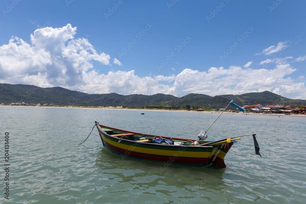 Traditional boat in the sea on sunny summer day.