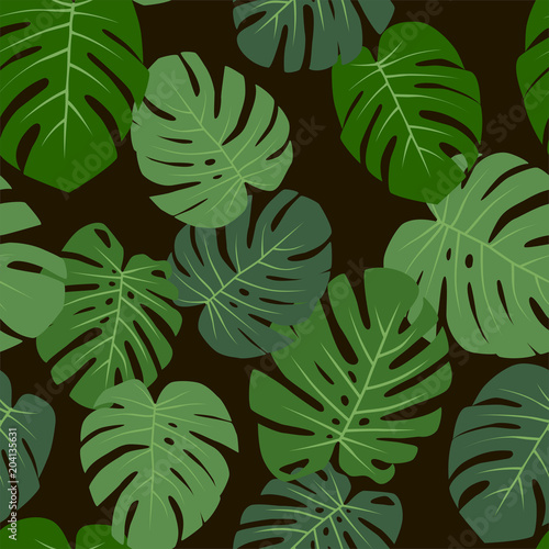 Floral tropical seamless pattern with monstera leaves on a black background. Vector.