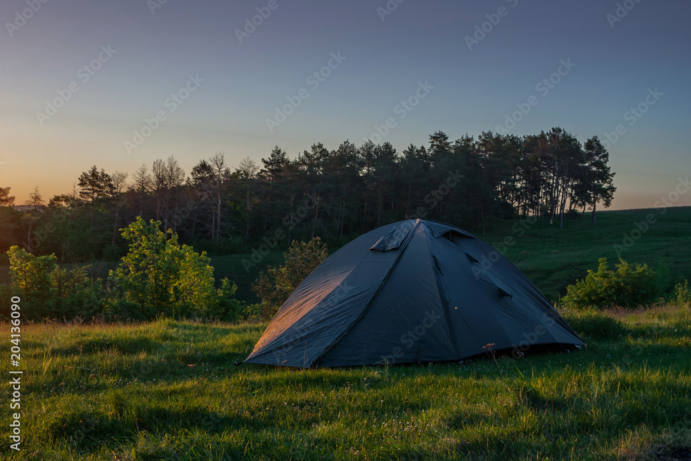 Tourist tent on the background of an old castle. Tourist tent on the background of an old castle.
