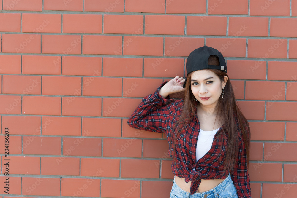 Portrait asian hipster girl on brick wall background,Hippie dress style,Thailand modern woman lifestyle,Beauty fashion portrait outdoor Portrait asian hipster girl on brick wall background,Hippie dress style,Thailand modern woman lifestyle,Beauty fashion portrait outdoor