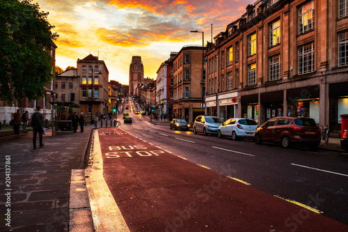 Famous street in the center of Bristol, UK in the evening during the colorful sunset
