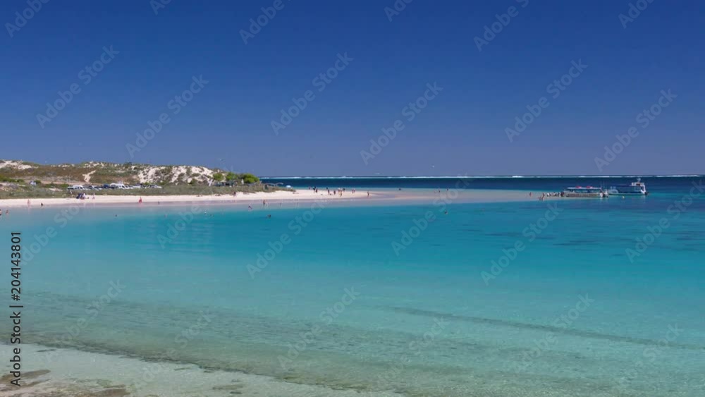 A steady shot of a white sand beach in Australia. A steady shot of a white sand beach in Australia.