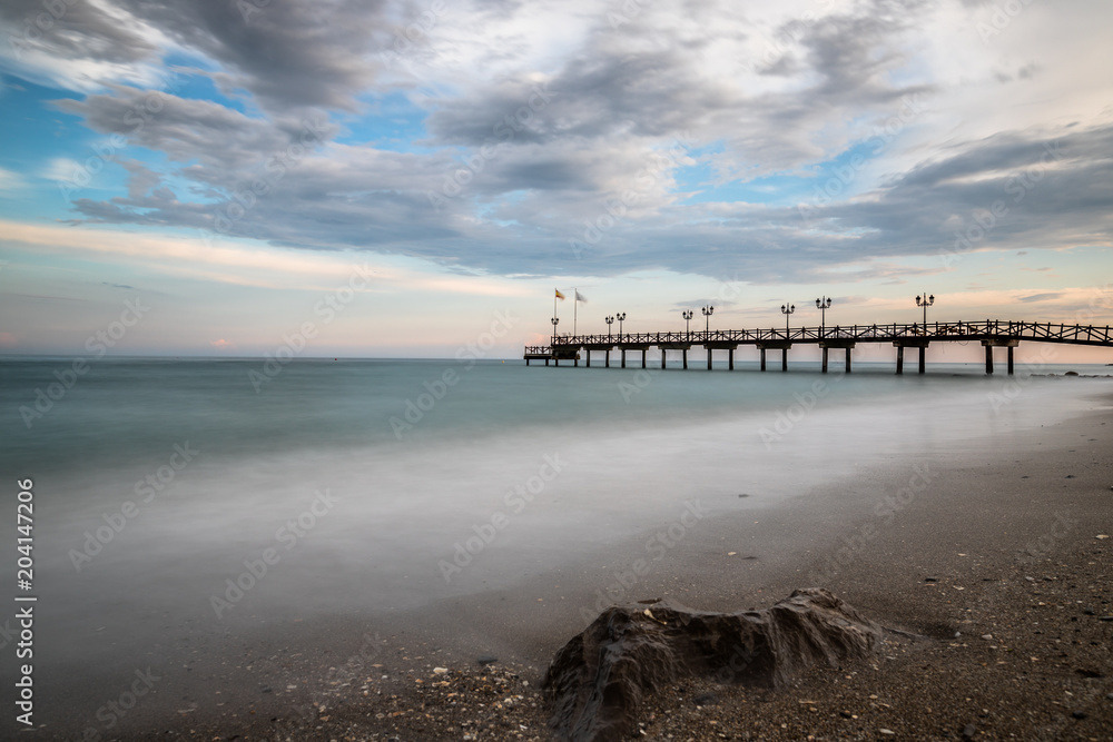 Beach in Marbella at Sunset on a cloudy day