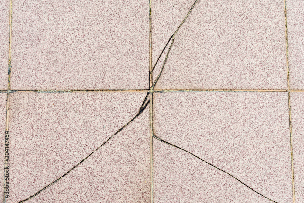Cracked ceramic tiles balcony floor surface due to improper residential